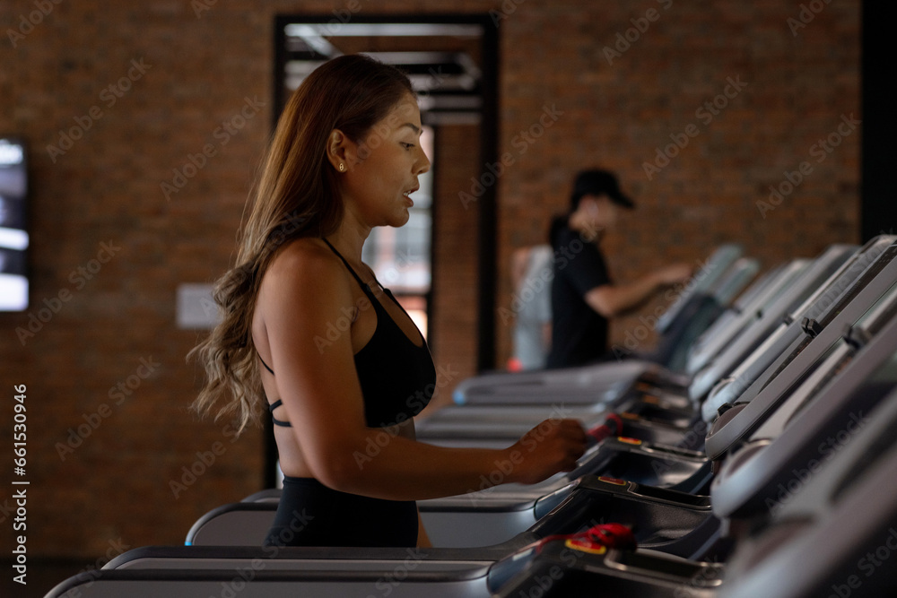 Asian woman walking on in modern gym, indoor fitness sport healthy concept