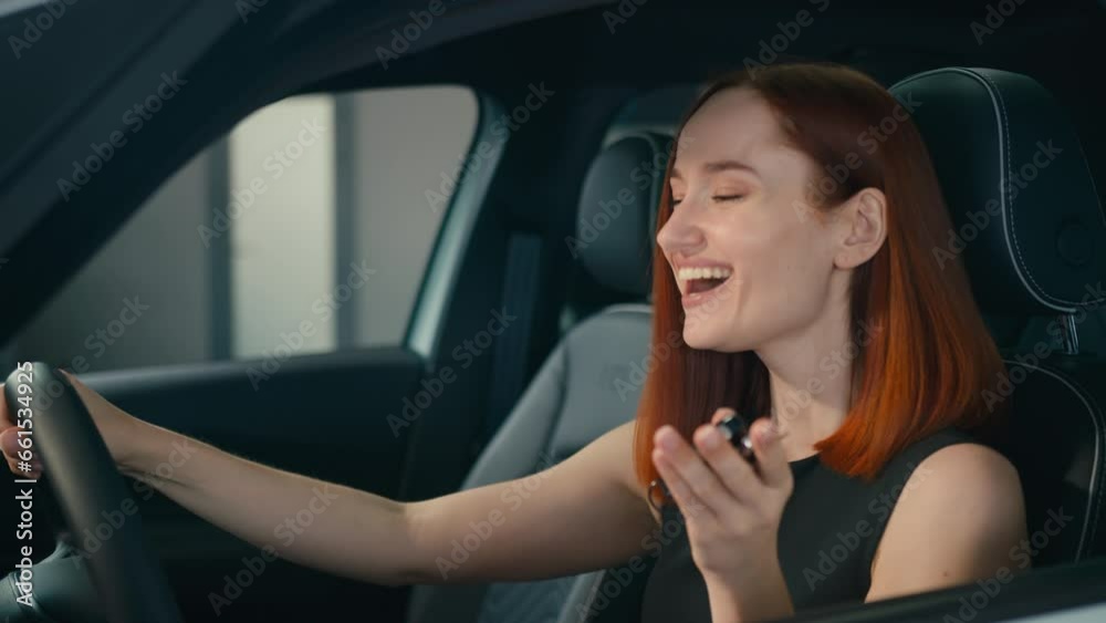 Excited female client buyer happy smiling woman inside new car owner showing keys to camera laughing enjoying buying auto girl in vehicle automobile salon store rent transport celebrate holding key Excited female client buyer happy smiling woman inside new car owner showing keys to camera laughing enjoying buying auto girl in vehicle automobile salon store rent transport celebrate holding key