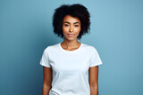 portrait of a woman with white clear t shirt isolated in blue studio