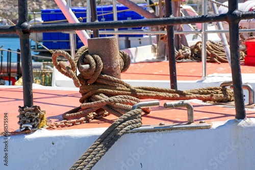 Close up of mooring rope attached to fishing trawler in Saldanha Bay harbour, Western Cape Province, South Africa photo