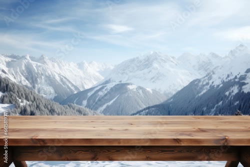 Wooden table against the backdrop of snow-capped mountains, a beautiful background with snowy Alps and sunny weather, product presentation in the mountains.