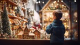 a boy is looking into Christmas decorated shop windows, the city, New Year's lights and garlands of the city, celebrating Christmas