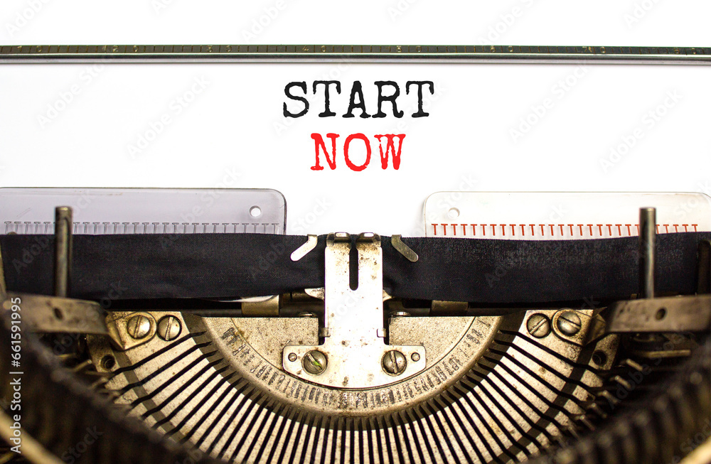 Start now symbol. Concept words Start now typed on beautiful old retro typewriter. Beautiful white paper background. Business marketing, motivational start now concept. Copy space.