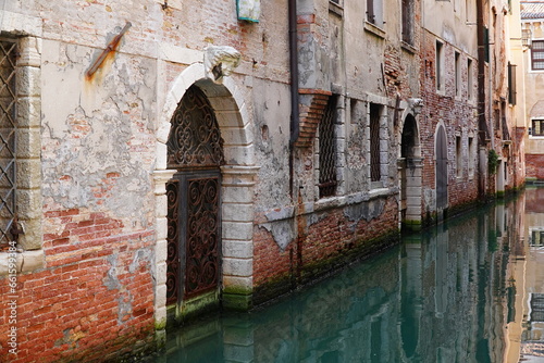 Salt damage to old bricks and marble in Venice, due to repeated flooding with salt water from the Adriatic coast of the Mediterranean Sea. Full image with erosion damage. Venice, Italy, Europe. © juerginho