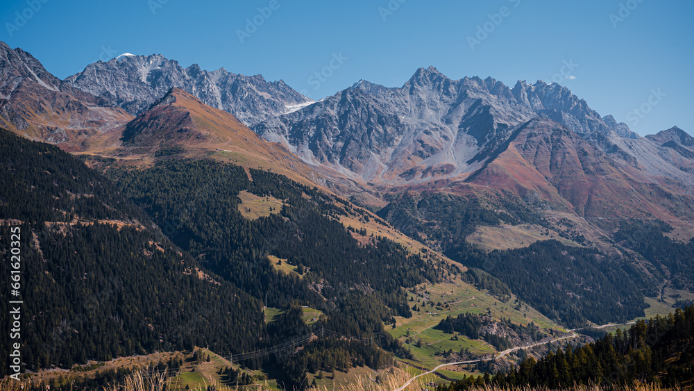 Landscape of the mountains, sky and forest in autumn in Switzerland.