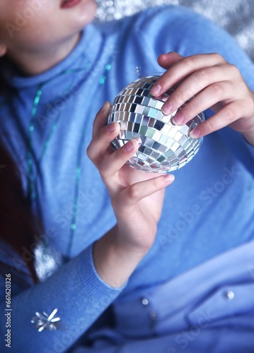 Girl holding a disco ball