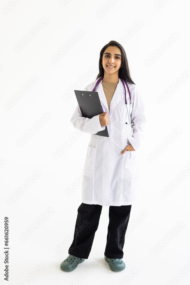 Smiling female doctor holding a clipboard on white background Smiling female doctor holding a clipboard on white background