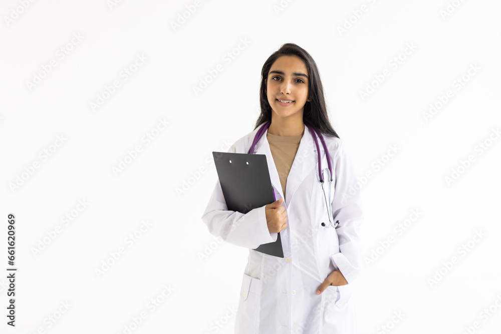 Smiling indian female doctor holding a clipboard on white background Smiling indian female doctor holding a clipboard on white background