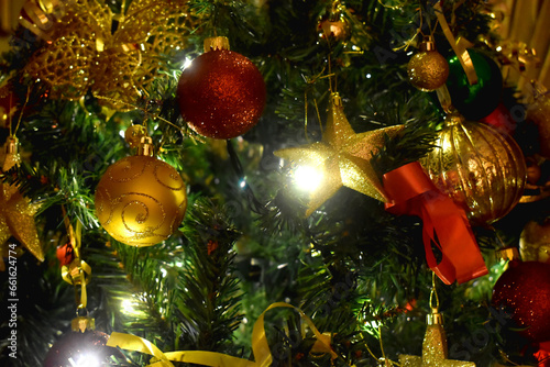 Beautiful Christmas ornaments on the Christmas tree with golden and red balls.  Christmas background.