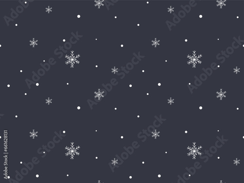 Winter snow seamless pattern. Hand drawn white snowflakes on gray. Seasonal holidays background. Cold weather