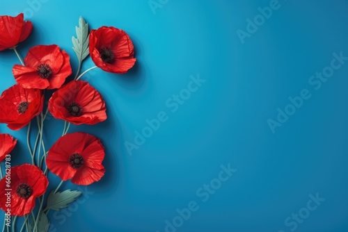 Banner with red poppy flowers on blue background, symbol for remembrance, memorial, anzac day