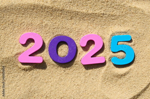 Concept celebrating tropical countries islands Colorfull numbers 2025 laid out on sand Close up Summer middle of winter Vacations Rest Copy space New Year vacation and travel agency Cover Copy space