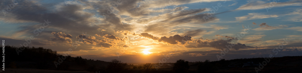 Rural landscape at sunset through the rain. Panorama. Rural landscape at sunset through the rain. Panorama.