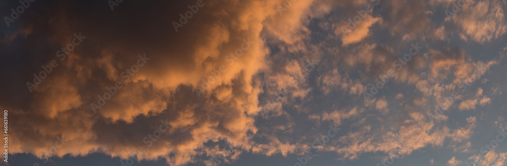 The evening sunset.  Cirrus cloudscape on blue sky.Tragic gloomy sky.