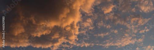 The evening sunset. Cirrus cloudscape on blue sky.Tragic gloomy sky.