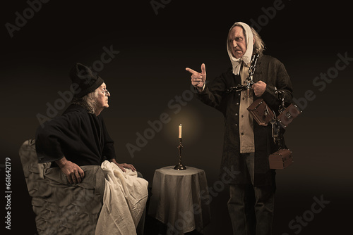 Ebenezer Scrooge having a discussion with the ghost of Jacob Marley, his deceased business partner photo