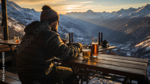 a person sits at a mountain ski resort