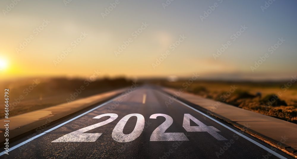empty street with the new year 2024 written on the road - concept of setting goals for the next year - obrazy, fototapety, plakaty 