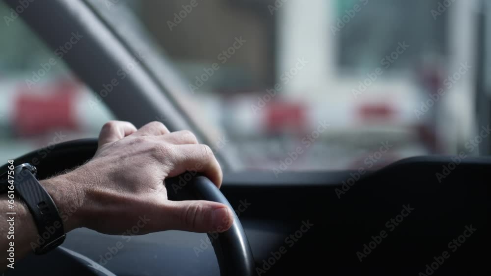 Focused Drive, Close-Up of Hand Gripping Vehicle Steering Wheel on Road Focused Drive, Close-Up of Hand Gripping Vehicle Steering Wheel on Road