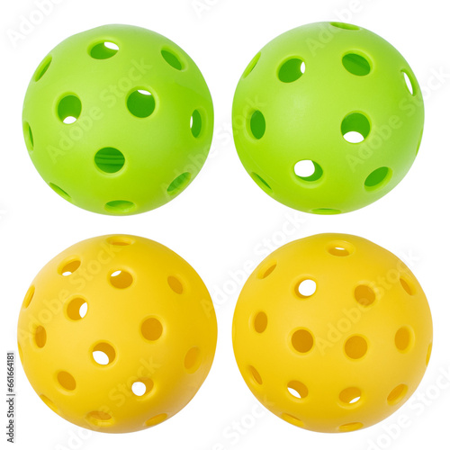 Pickle balls, two yellow and two green