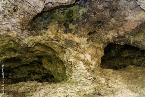 Karst cave. Background with selective focus and copy space © Iurii Gagarin