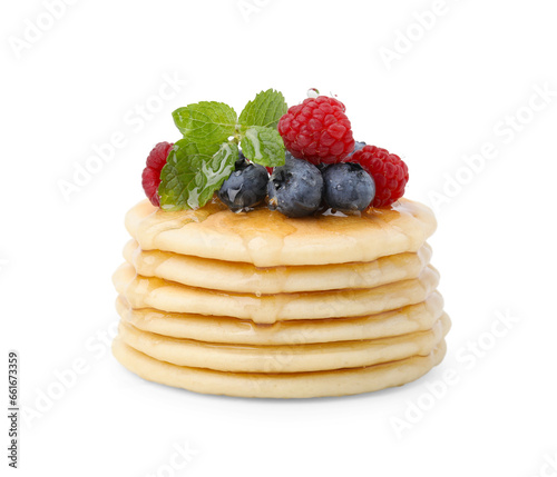 Delicious pancakes with berries, honey and mint isolated on white