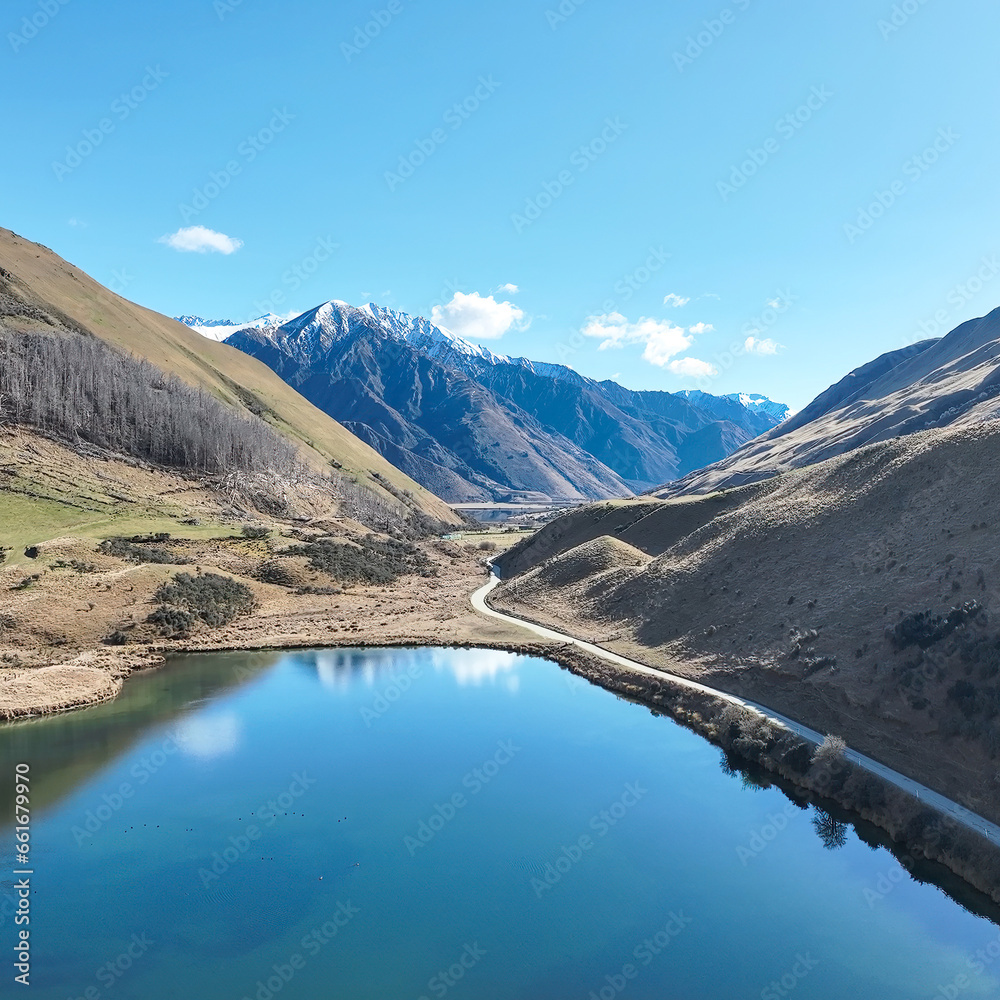 Obraz premium Drone shot of Lake Kirkpatrick on the way to remote rural alpine Moke Lake near Queenstown