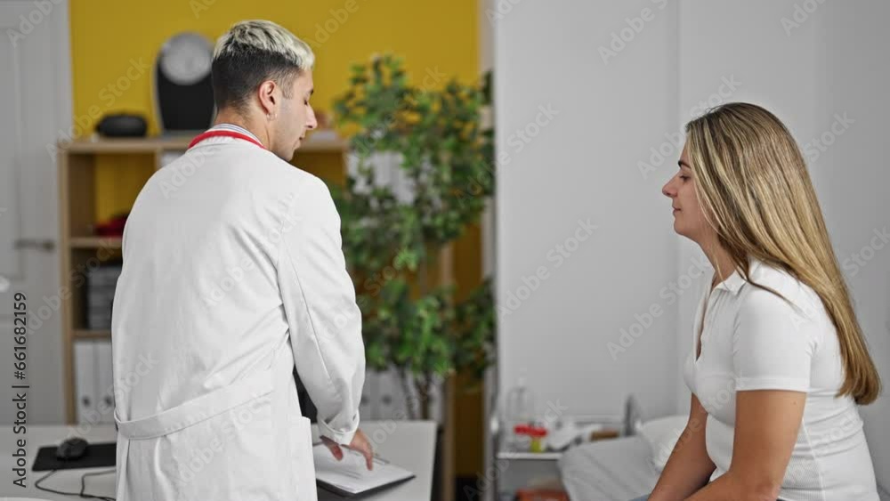 Doctor and patient writing medical report measuring pulse at the clinic