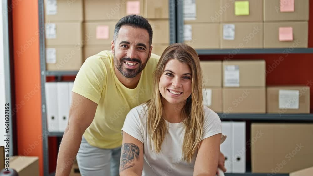 Man and woman ecommerce business workers working together smiling at office Man and woman ecommerce business workers working together smiling at office