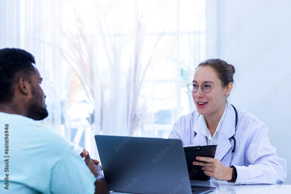 Doctor holding checklist and talking to man Patient at hospital. Physician examining male patient in hospital room.. Doctor holding checklist and talking to man Patient at hospital. Physician examining male patient in hospital room..