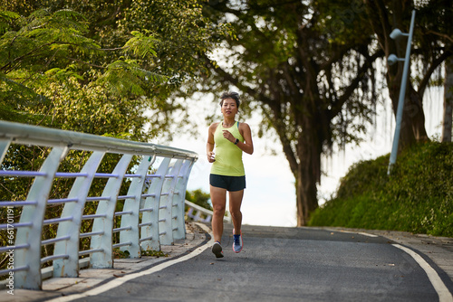 young asian woman running jogging outdoors