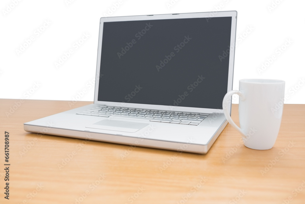 Digital png illustration of laptop and mug on wooden desk on transparent background Digital png illustration of laptop and mug on wooden desk on transparent background