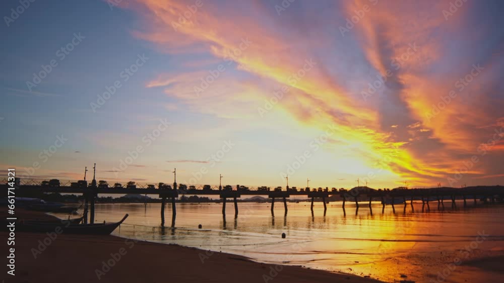 .amazing colorful yellow light through the red cloud in sunrise..Sunrise with sweet yellow color light rays and other atmospheric effects..colorful reflection of sunrise in the sea background.