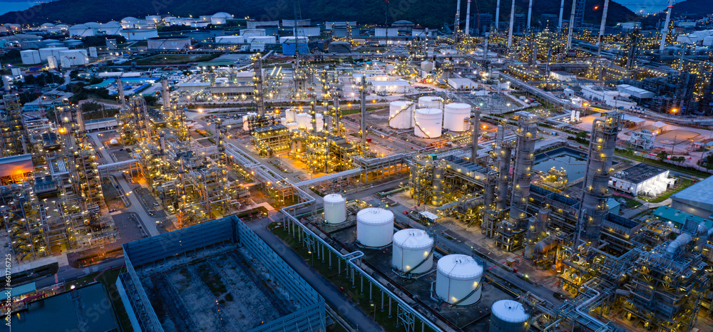 Oil refinery. Aerial view of oil and gas industry refinery. Petrochemical plant area and oil storage tank energy concept during the evening energy concept