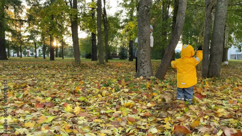 happy mother playing with little son on walk in autumn park. Ascension Sophia Cathedral, Pushkin, Saint Petersburg, Russia happy mother playing with little son on walk in autumn park. Ascension Sophia Cathedral, Pushkin, Saint Petersburg, Russia