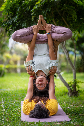 Acroyoga Lunar therapy, Thai massage, couple massage, outdoors, with bamboo background