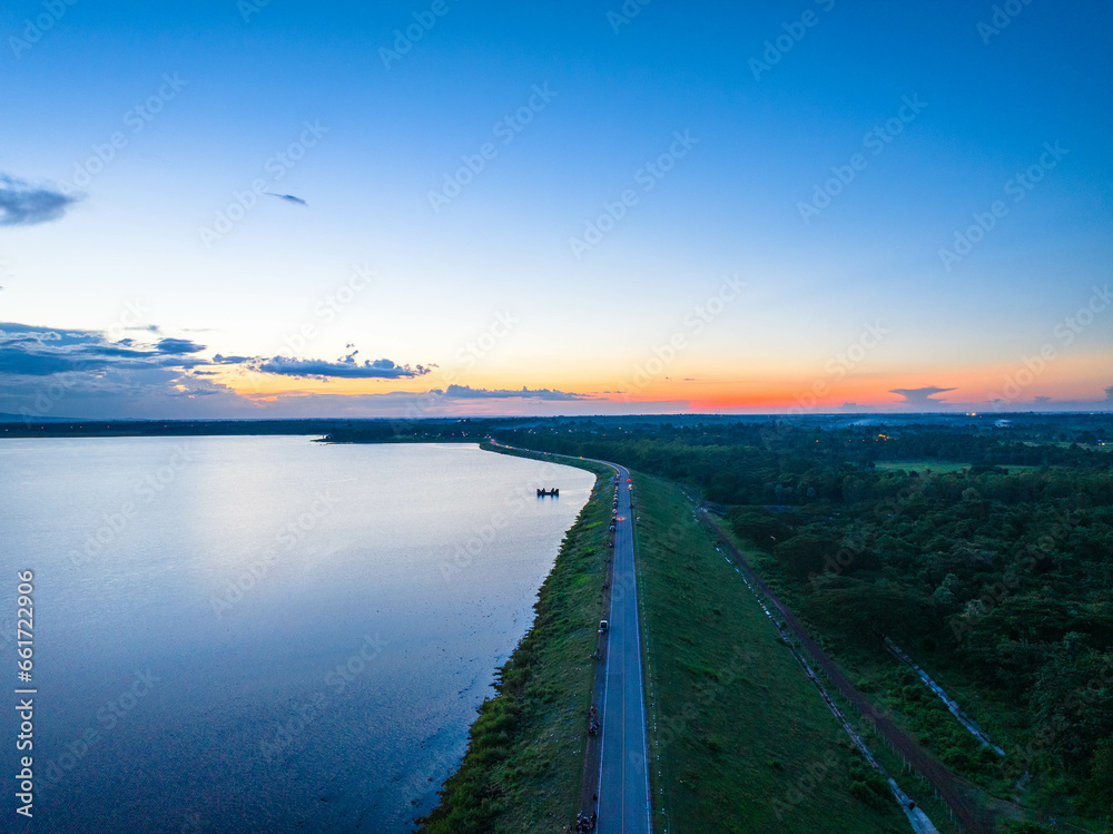 Colorful sunset with blue sky.at Nam Oon Dam, Phang Khon, Sakon Nakhon, Thailand.