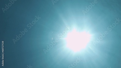 underwater bottom look up to the surface view to ripple bubble sea salt ocean blue water to sunshine light beam ray through with various fish back light silhouette calm relax curious swimming around