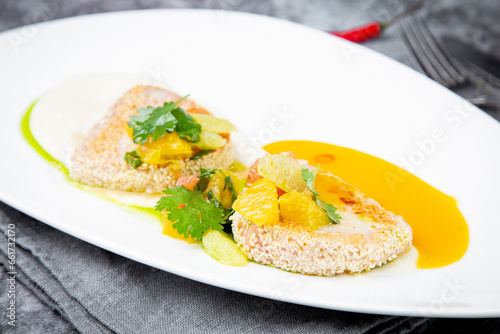 fish with tangerines  parsley and sesame breaded side view