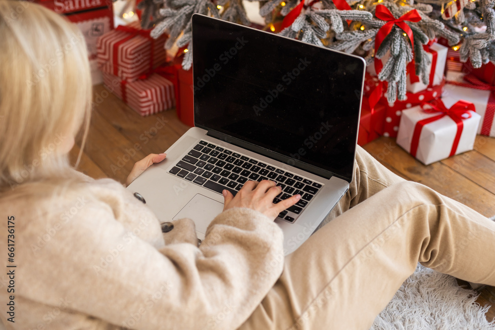 Portrait of attractive cheerful girl watching video resting at christmas Portrait of attractive cheerful girl watching video resting at christmas