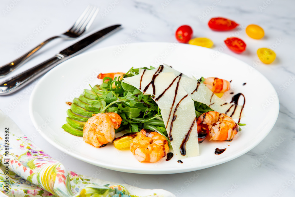 shrimp with avocado slices and arugula with teriyaki sauce side view shrimp with avocado slices and arugula with teriyaki sauce side view