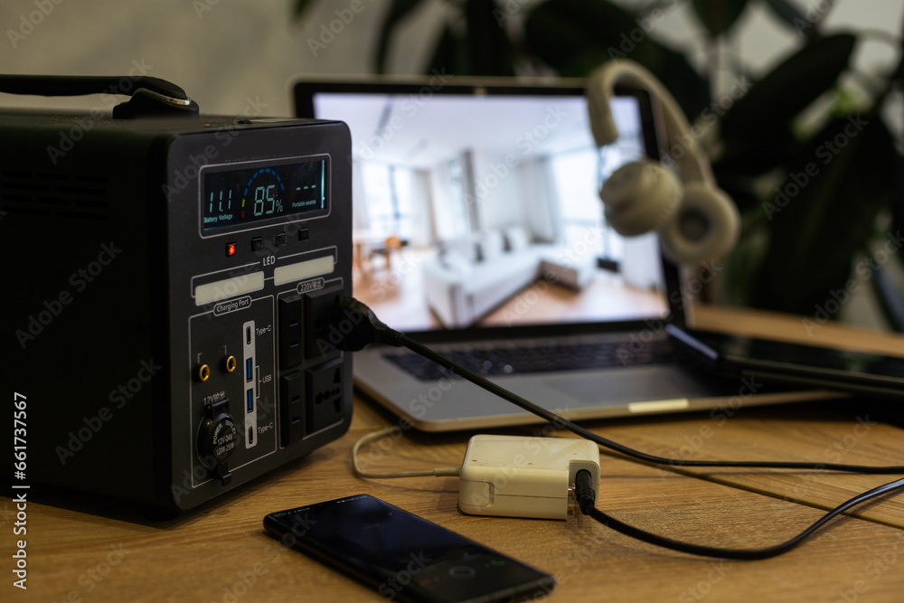 A studio desk with a PC laptop and controller on a wooden desk A studio desk with a PC laptop and controller on a wooden desk