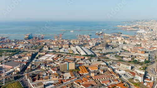 Fototapeta Naklejka Na Ścianę i Meble -  Naples, Italy. Panorama of the city overlooking the port and the railway station. Daytime, Aerial View