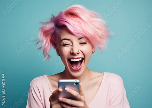 Happy young woman with colored hair and a smartphone