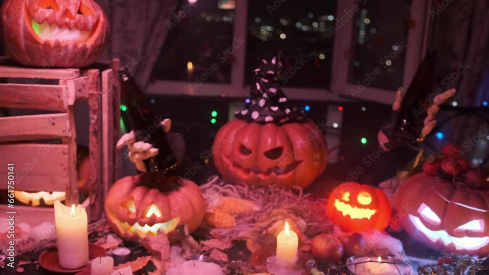 Festive carved pumpkin creepy hands with bottles of beer invites friends guests to join Halloween festival party and celebrate among spooky traditional decoration day of dead. Festive carved pumpkin creepy hands with bottles of beer invites friends guests to join Halloween festival party and celebrate among spooky traditional decoration day of dead.