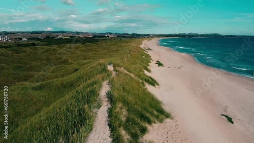 Aerial view over the beach and transparent, arctic sea in Norway - Bird's-eye, drone shot