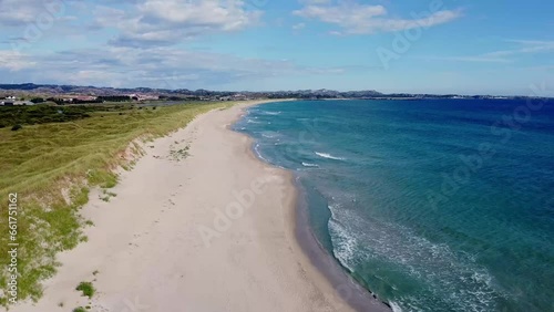 Aerial view over the beach and transparent, arctic sea in Norway - Bird's-eye, drone shot