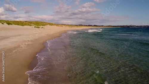 Aerial view over the beach and transparent, arctic sea in Norway - Bird's-eye, drone shot