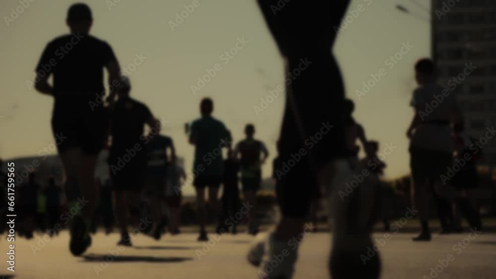 Health and sports. Runners at half marathon event. Abstract blurry Health and sports. Runners at half marathon event. Abstract blurry