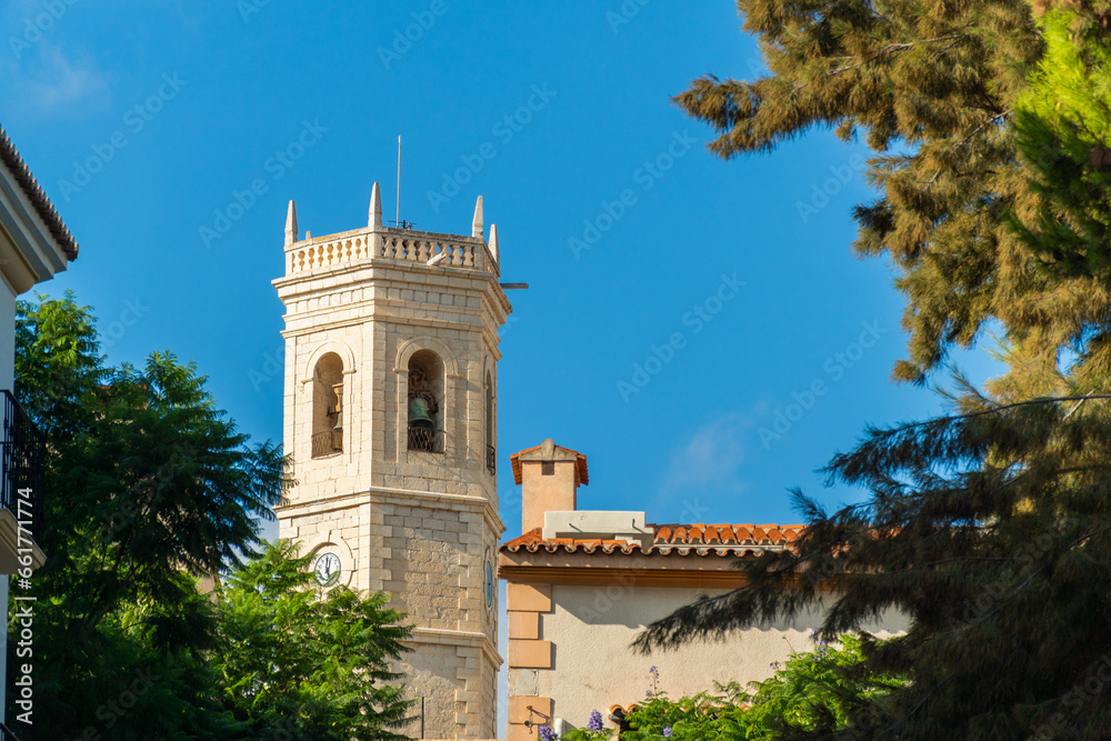  Bell tower against blue sky, in Teulada, Alicante (Spain).